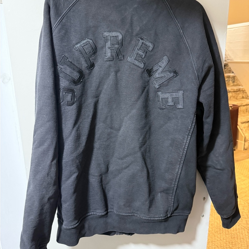 Supreme Black Jacket with Red Tag; sweatshirt material, snap up